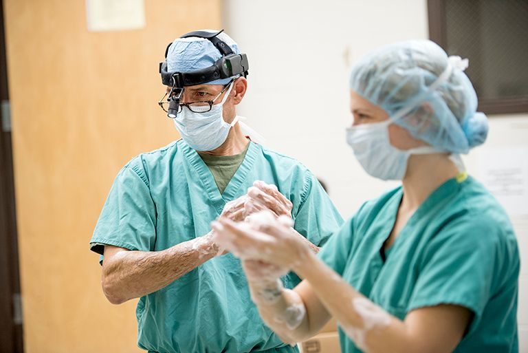 Surgery team members prepare for a procedure