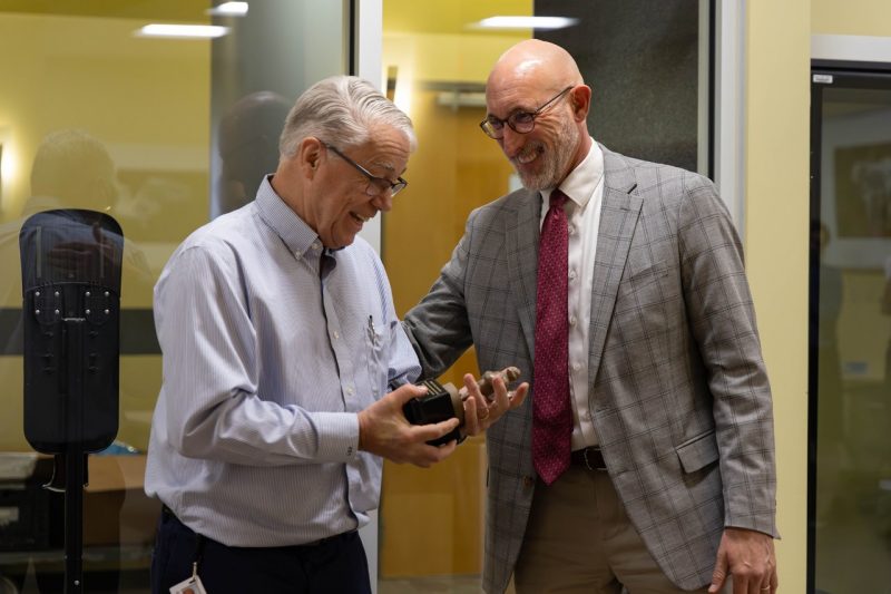 Dean Givens awarding Gregory Daniel with his retirement gift. 