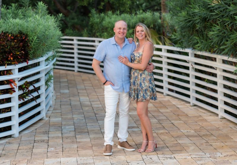 Two people standing together and posing for a photo